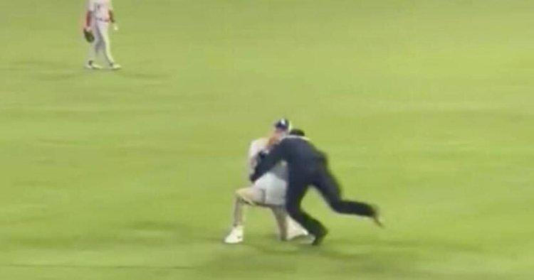 Dodgers fan gets tackled during on-field marriage proposal