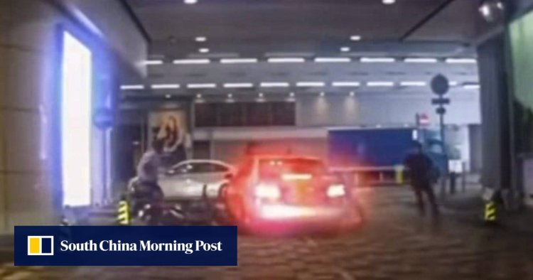 Hong Kong policeman clings to Mercedes-Benz as suspected triad member drives off after hitting motorcycle