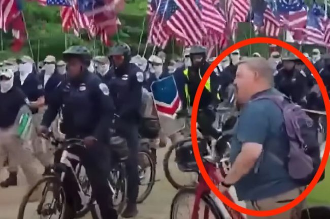 Cyclist Taunts Marching White Supremacists With Outstandingly Timed Heckles