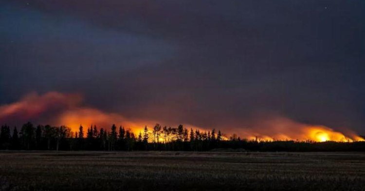 "Truly frightening wildfires" force thousands to evacuate in Canada