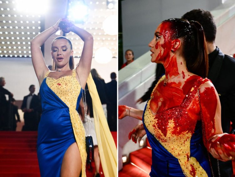 See the moment when a woman wearing Ukraine's flag colors strode up the stairs at Cannes and poured what looked like blood all over herself