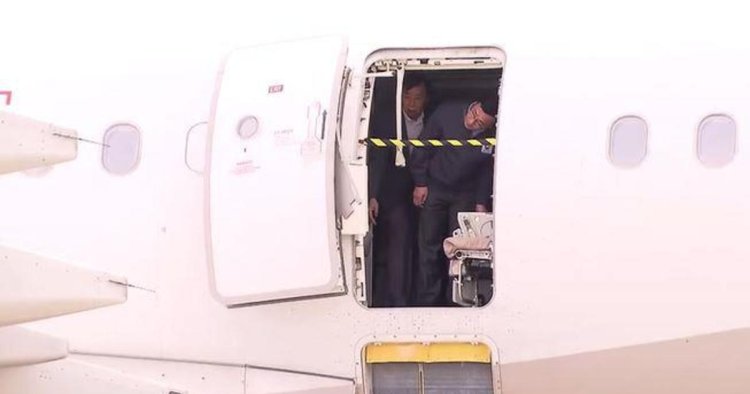 Passenger arrested for opening plane door minutes before landing