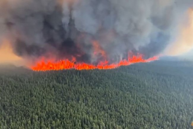 Wildfires spread in British Columbia, Quebec sees signs of progress