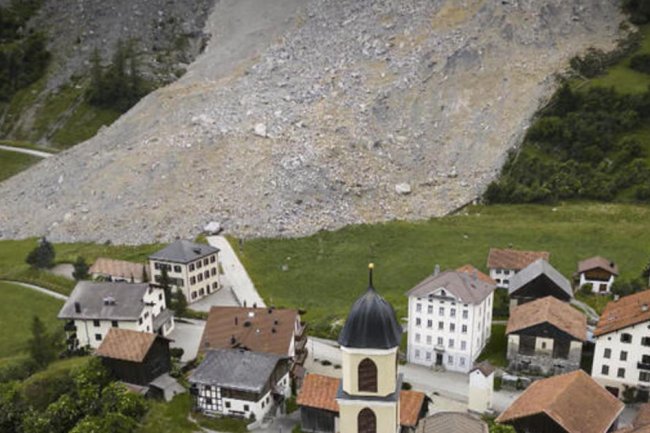 Eye Opener: Mountain collapse narrowly avoids Switzerland village