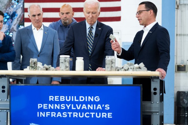 As Trump Battles Charges, Biden Focuses on the Business of Governing