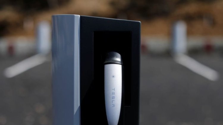 GM embraces Tesla's EV charging system, Wall Street cheers