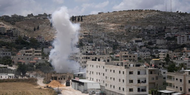 Israeli military helicopters fired in the direction of Palestinian militants engaged in a fierce gunbattle with Israeli troops in the occupied West Bank, in an episode that killed at least five Palestinians.