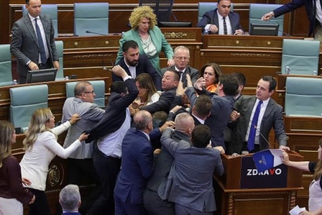 Kosovo's PM gets doused with water, inciting a brawl in parliament