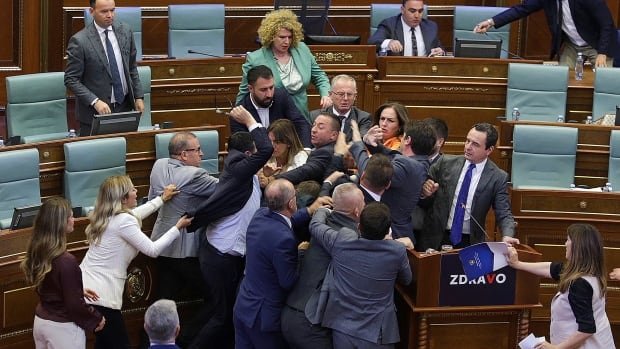 Kosovo's PM gets doused with water, inciting a brawl in parliament