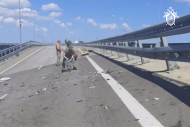 Key Russian bridge to Crimea is attacked again, with Moscow blaming Ukraine for blast that kills 2