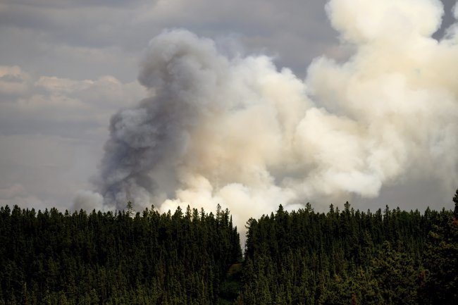 Firefighters curb blazes threatening 2 cities in western Canada but are ‘not out of the woods yet’