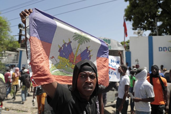 A gang in Haiti opens fire on a crowd of parishioners trying to rid the community of criminals