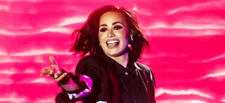 Demi Lovato Serves Face Card, Fashion, & Romance In Photo Dump From “Chef’s Kiss” Summer