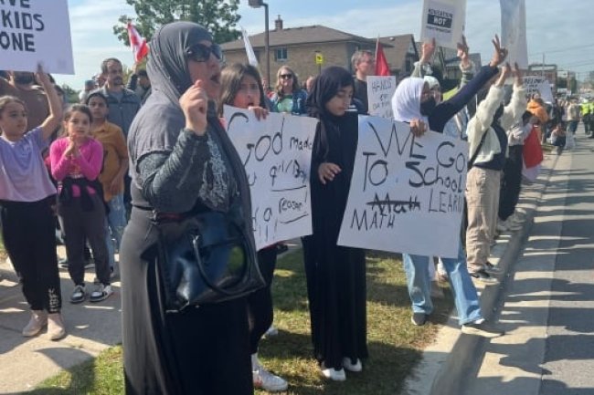 LGBTQ policy protesters and counter-protesters rally outside London, Ont. school board office