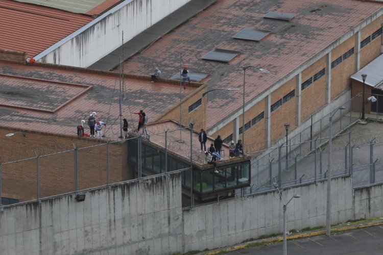 Ecuador says 57 guards and police officers are released after being held hostage in several prisons