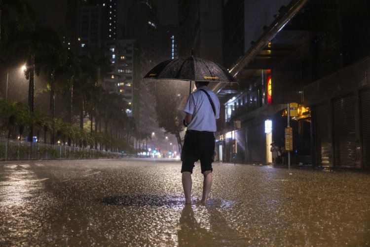 Rain pouring onto Hong Kong and southern China floods city streets and subway stations